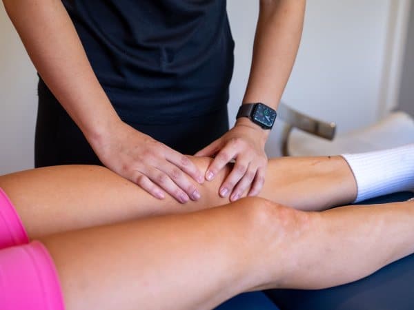 physio assessing an injured knee